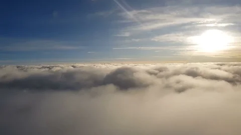 Flying in beautiful clouds, close-up clouds from plane window, 4k UHD footage Stock Footage 85128831