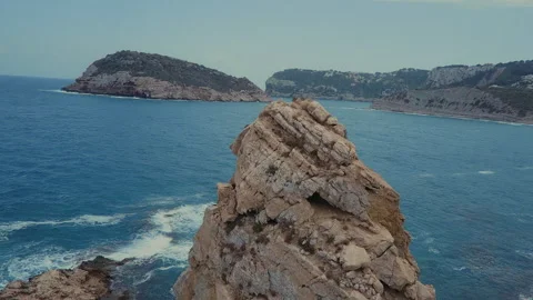 Flying on a beautiful rock towards the ocean Stock Footage 223378952