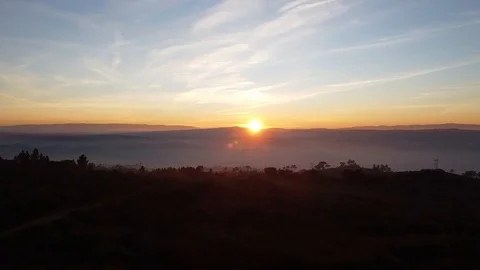 Flying in a beautiful sunset through the mountains Video stock 128777415