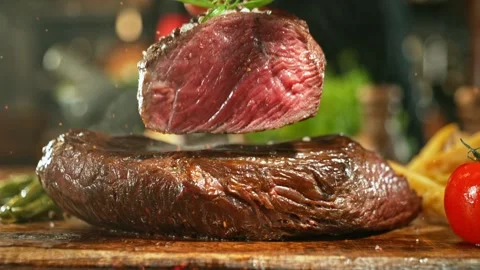 Flying beef steak falling on another steak. Stock Footage 266997113