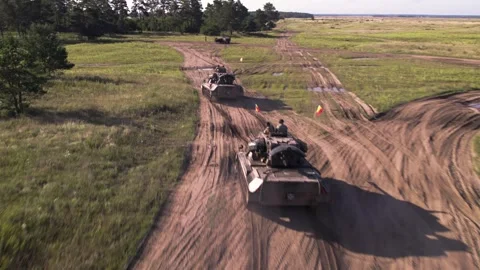 Flying behind armoured column Stock-Footage 250980002