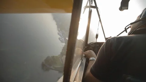 Flying behind the pilot in the floatplane over Lake como. Turning Video stock 127823248