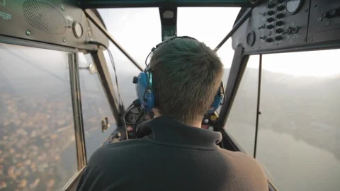 Flying behind the pilot in the floatplane over Lake como. Stock Footage 127823316