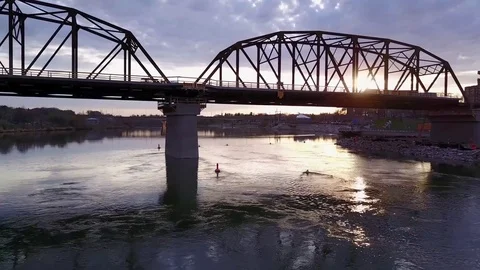 Flying beside bridge under construction Stock Footage 77718915
