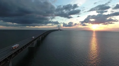 Flying besides bridge in sunset Video stock 64872091
