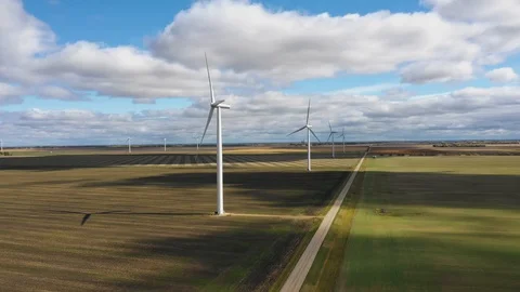 Flying besides windmills in a wind farm Stockbeeldmateriaal 101000120