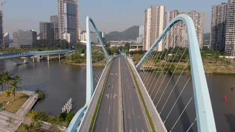 Flying between the arches of the cable-stayed bridge of unusual construction. Stock Footage 118287587