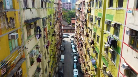 Flying between buildings in dense old district looking downward, Hong Kong Stock Footage 150445826