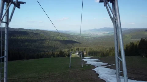Flying between the cable cars on the slopes in the spring. Forest landscape on a Stock-Footage 201161823