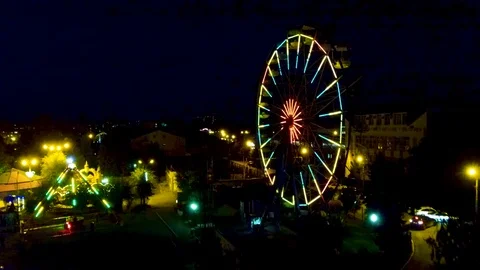 Flying between carousels in the evening Stock Footage 97856489