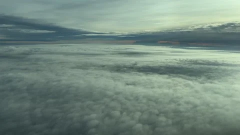 Flying Between Layers of Ethereal Clods at Dawn: A Pilot’s View From a Jet Stock Footage 304489295