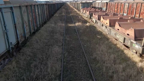 Flying between old rusted wagon trains Stock Footage 219743473