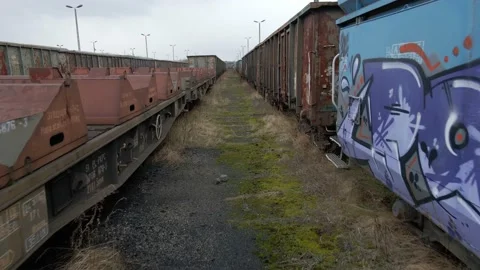 Flying between old rusted wagon trains Stock Footage 219743525