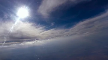 Flying between the sun and the clouds Stock Footage 85875434