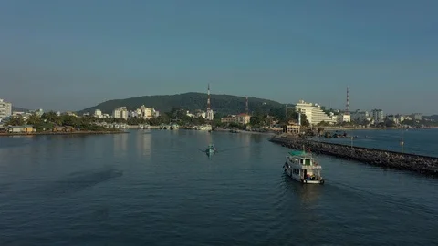 Flying between two boats on sea water in harbour in Phu Quoc island Vietnam in s Stock Footage 124106873