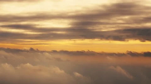 Flying in Between Two Layers of Clouds During Sunset 스톡 동영상 133185229