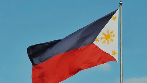 Flying bicolor flag of the Philippines with central golden sun representing the Stock Footage 85959869