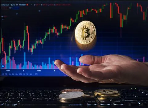 Flying Bitcoin with hand concept Stock Photos