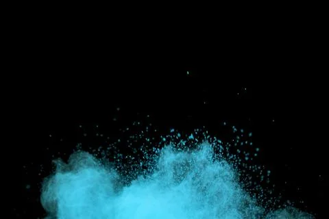 Flying blue colored dust particles Foto stock