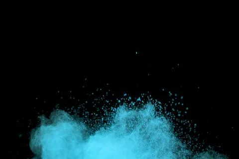 Flying blue colored dust particles Stock Photos