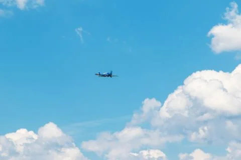 Flying blue plane Stock Photos