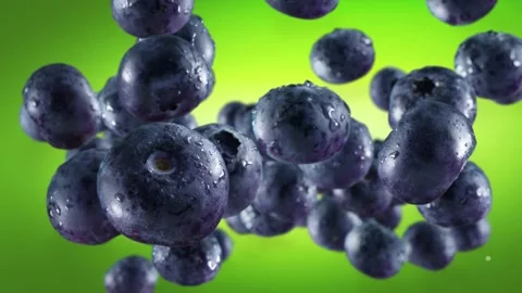 Flying of Blueberries in Green Background Stock Footage 148331780