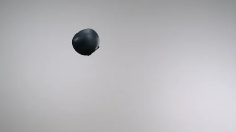 A flying blueberry passing through in front of the camera in slow motion Stock Footage 161526521