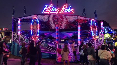 Flying bobs carnival ride spinning at th... | Stock Video | Pond5