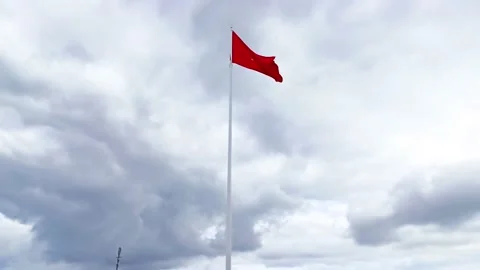 Flying the bold national flag on a windy afternoon in Dai Doan Ket Square Gia Stock Footage 142633401