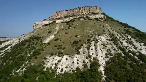 Flying from the bottom up on a drone along the cliff Stock Footage 160467017