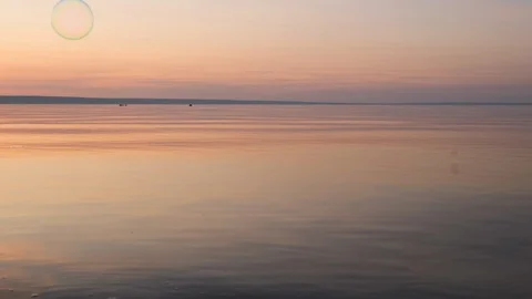 Flying bubbles over the water at sunset. Anti-stress video. Abstract video. Stock Footage 114986286