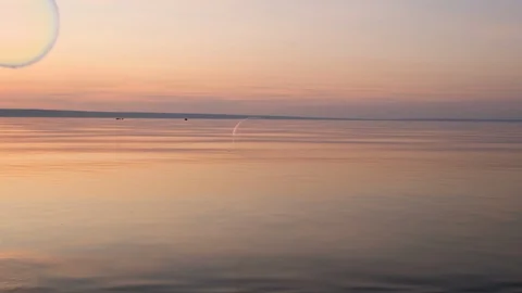 Flying bubbles over the water at sunset. Anti-stress video. Abstract video. Stock Footage 114987565