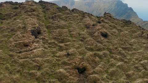 Flying into caldera of vast inactive volcano. Lake on the top of Caldeirao Stock Footage 119892027
