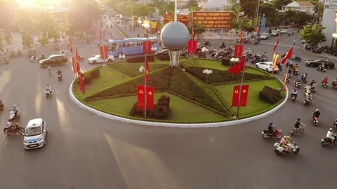 A  flying camera around a circular motion view of the bike city traffic Video stock 100187599