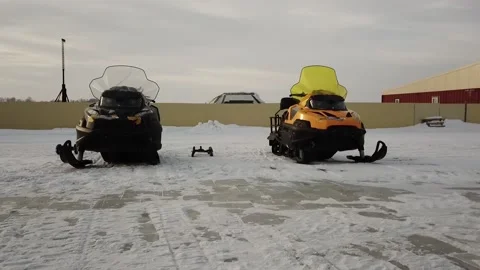 Flying camera captures the movement of snowmobiles in the fields Stock Footage 146630918