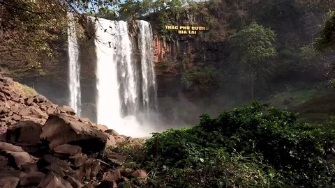 A flying camera captures a waterfall in Vietnam Stock Footage 123425298