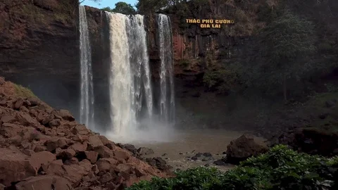 A flying camera captures a waterfall in Vietnam Stock Footage 123425333