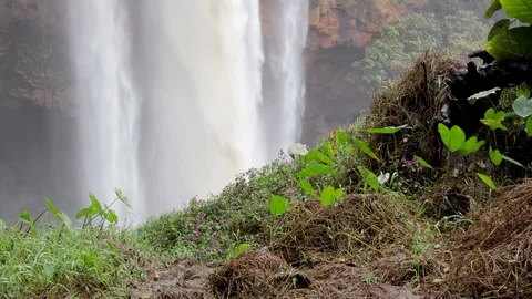 A flying camera captures a waterfall in Vietnam Stock Footage 123425934