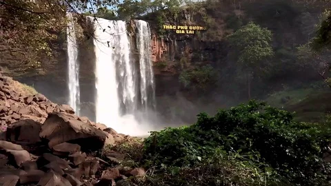 A flying camera captures a waterfall in Vietnam Stock Footage 124913186