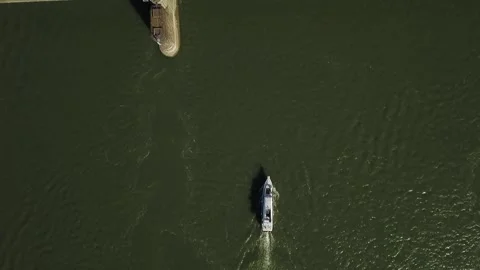 A flying camera chases a passenger boat on the ob river in siberia Stock Footage 138881624