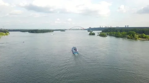 A flying camera chases a passenger boat on the ob river in siberia Stock Footage 138881711