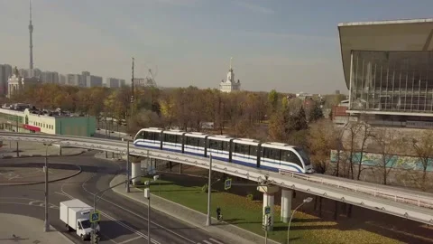 Flying camera chases train monorail passing by VDNKh 스톡 동영상 164794116
