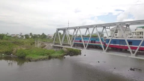 A flying camera is chasing a train Stock Footage 240219175