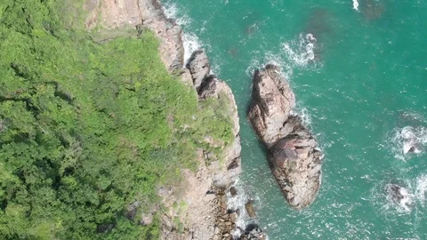 A flying camera flies beautifully over a rocky seashore overlooking  in Vietnam Stock Footage 100189758