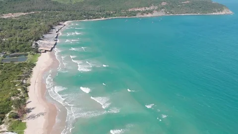 Flying camera flies over a beautiful beach overlooking the waves Stock Footage 115724359