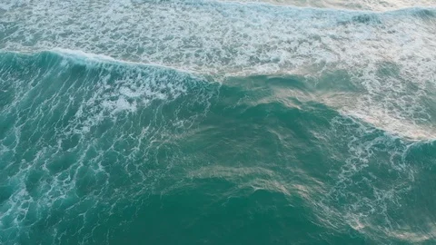 Flying camera flies over a beautiful beach overlooking the waves Video stock 116113860