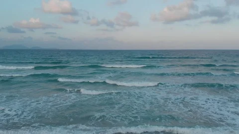 Flying camera flies over a beautiful beach overlooking the waves Stock Footage 116114882
