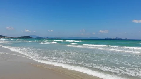 Flying camera flies over a beautiful beach overlooking the waves Video stock 116118853