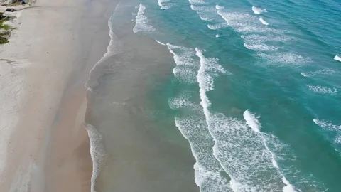 Flying camera flies over a beautiful beach overlooking the waves Stock Footage 116119004