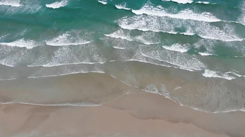 Flying camera flies over a beautiful beach overlooking the waves Stock Footage 116119074
